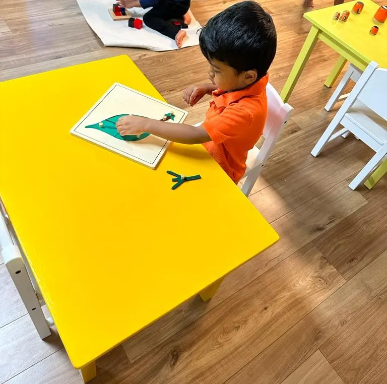 A child assembling a botany leaf puzzle