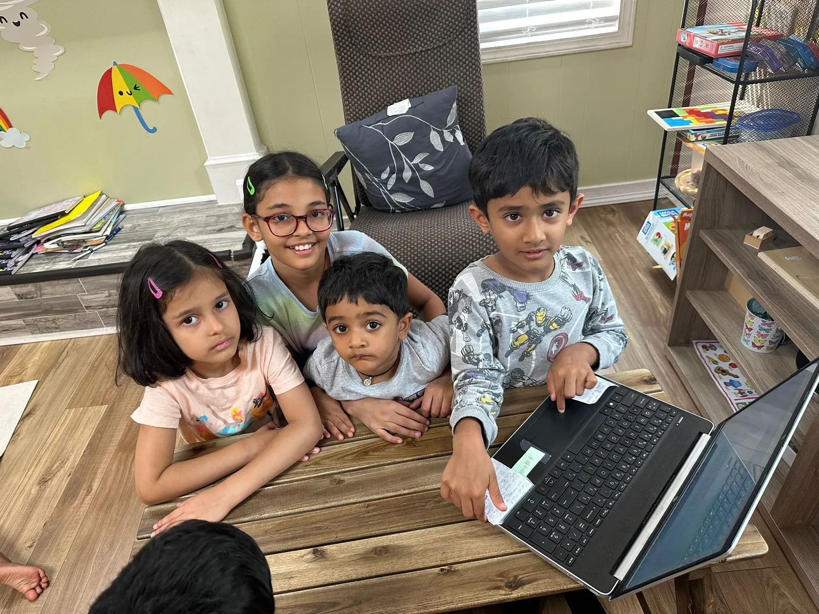 Children learning to code on a laptop
