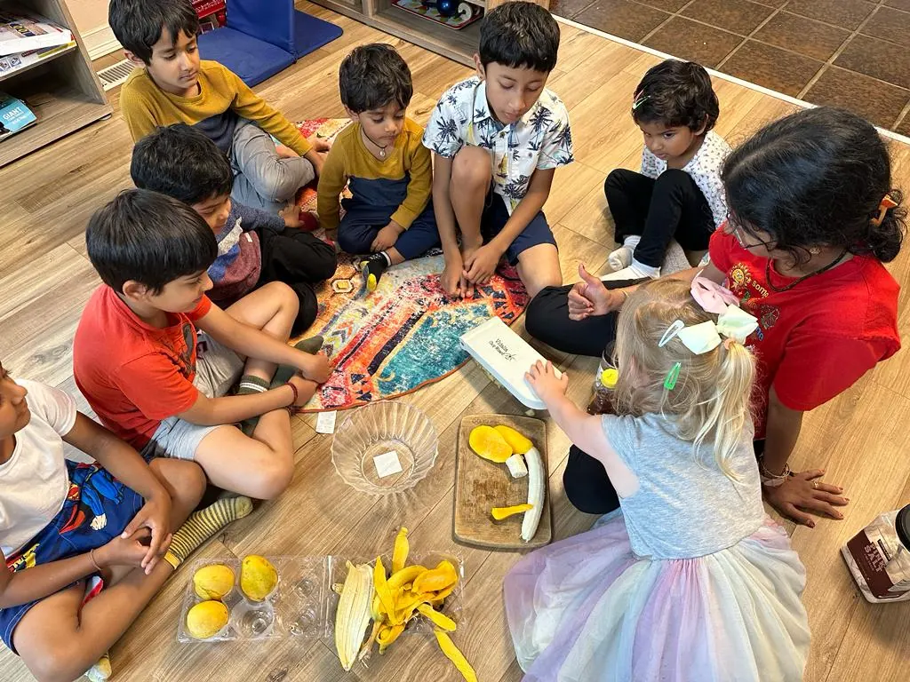 Children cutting vegetables together